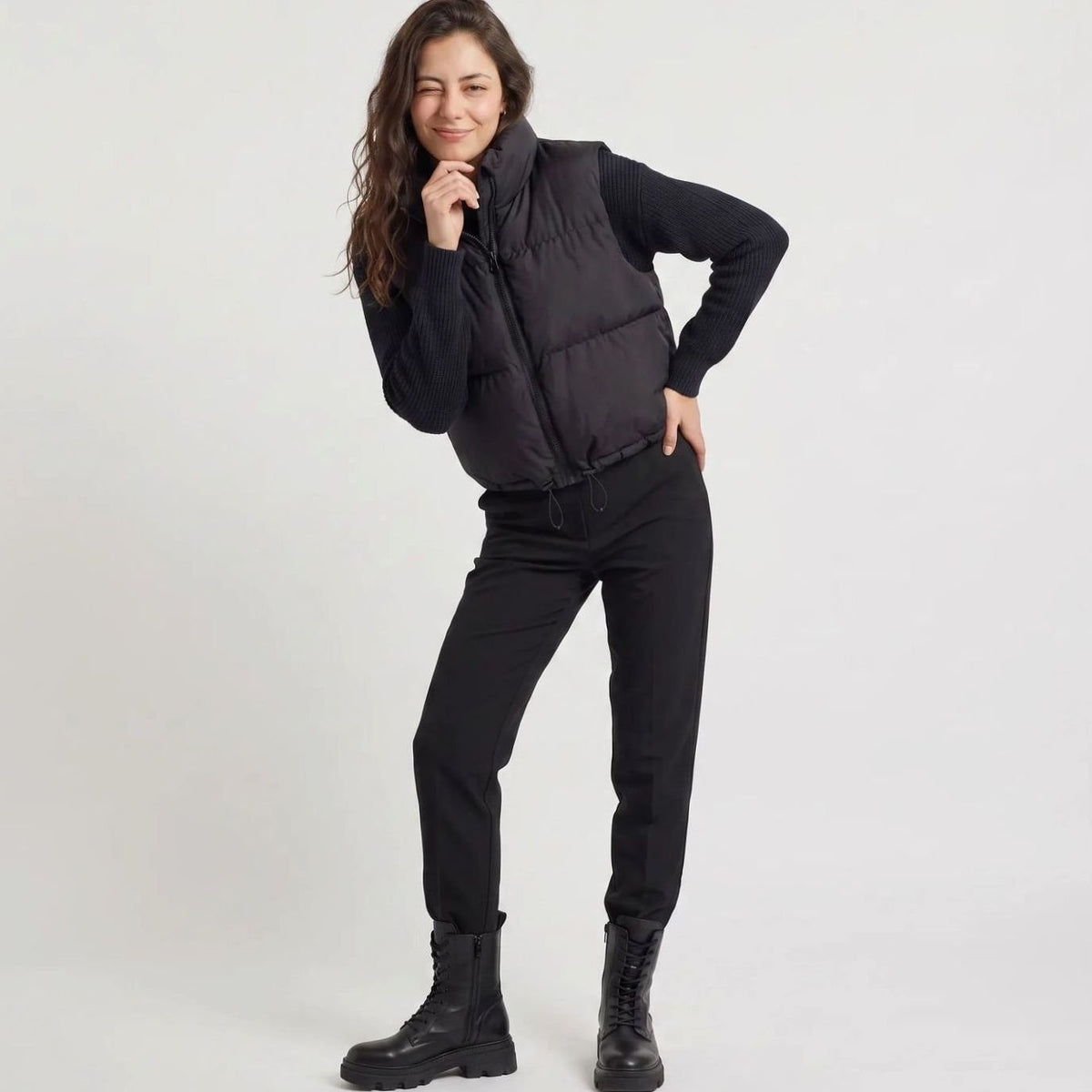 Women's casual cropped quilted puffer vest by Homixa with high collar and zip-front, sleeveless design, perfect for layering.