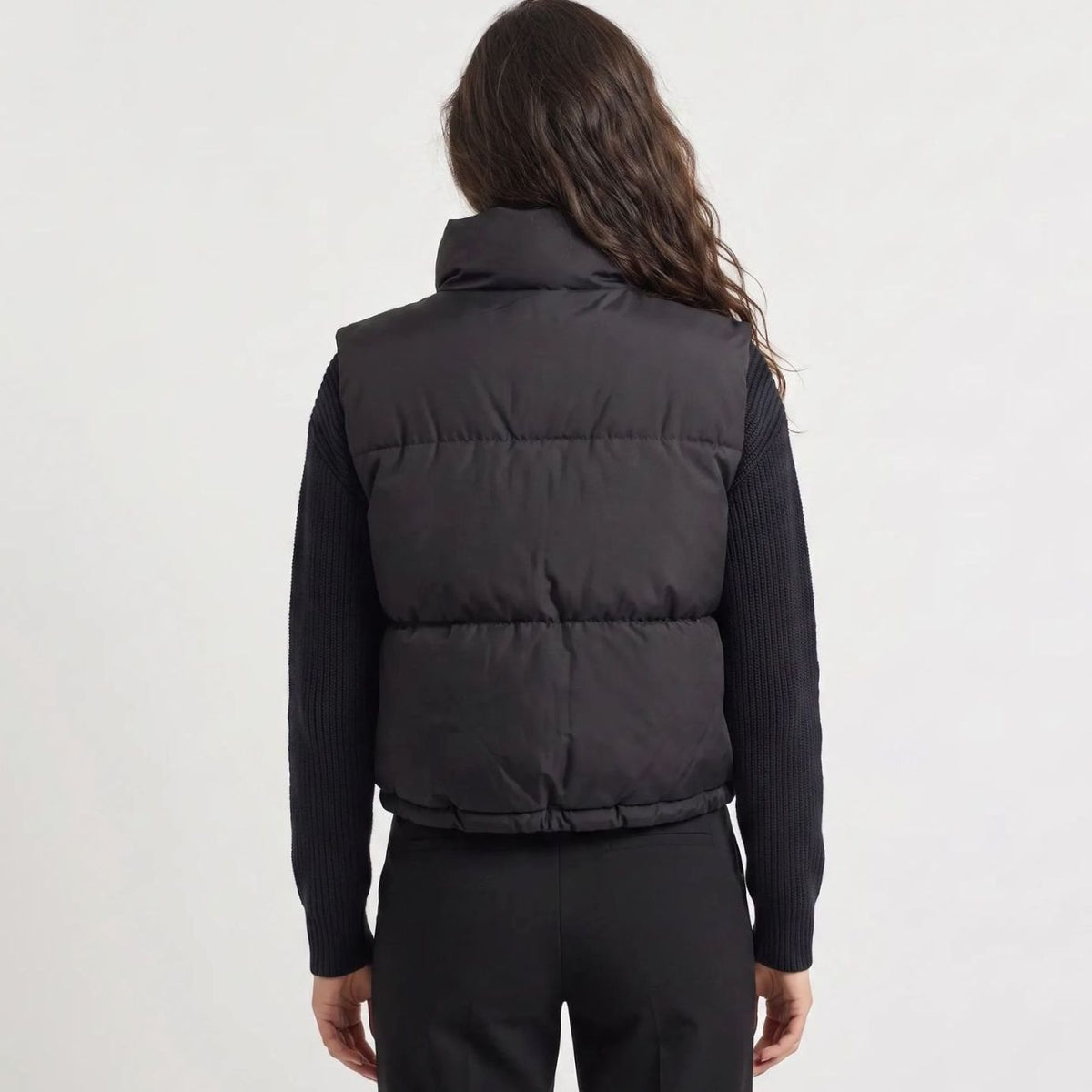 Women's casual cropped quilted puffer vest by Homixa with high collar, sleeveless design, and zip-front closure.