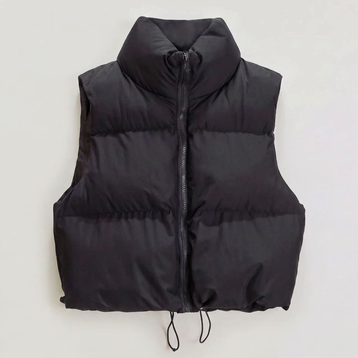 Women's casual cropped quilted puffer vest with high collar and zip front, sleeveless design by Homixa.