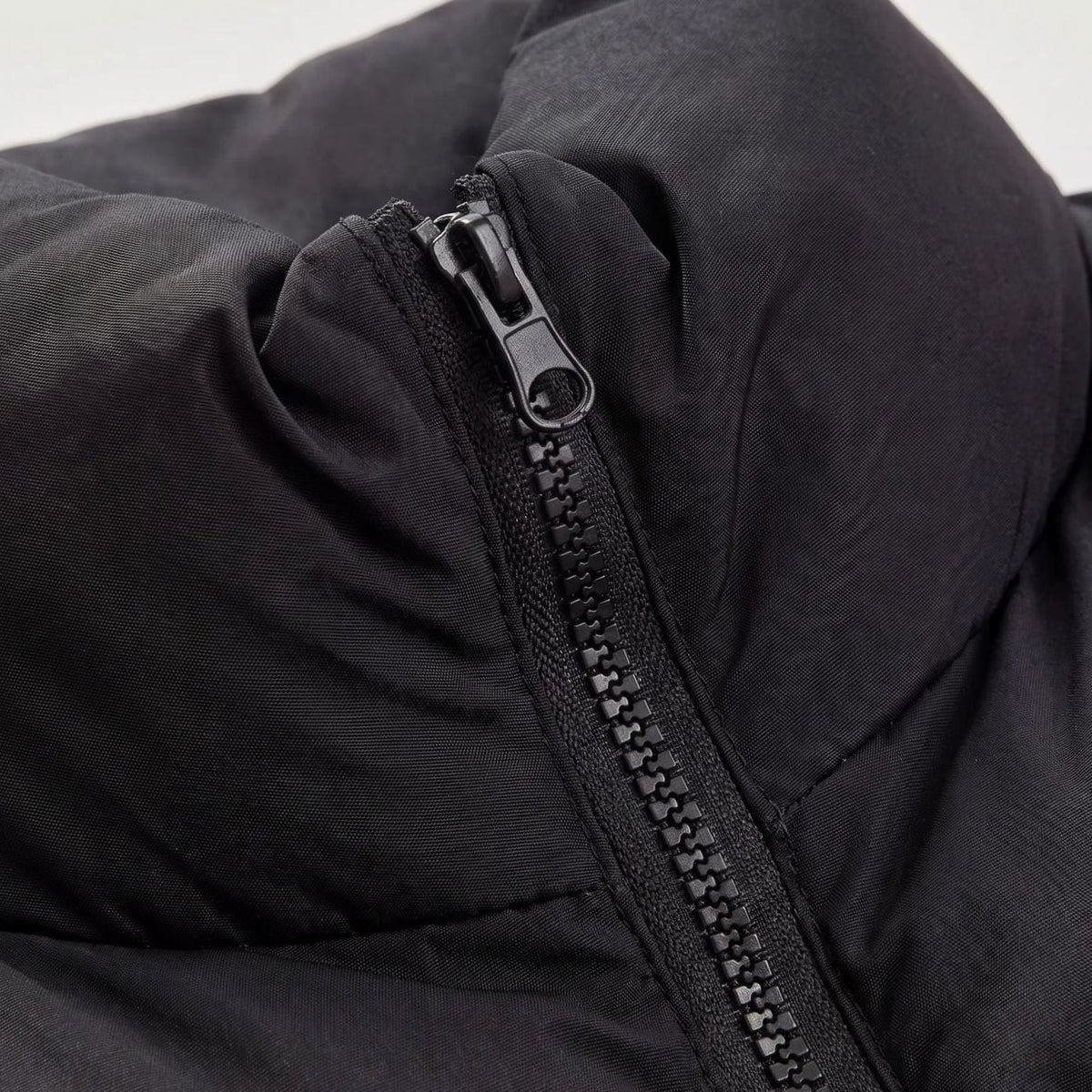 Women's casual cropped quilted puffer vest by Homixa featuring a high collar, sleeveless design, and zip-front closure.