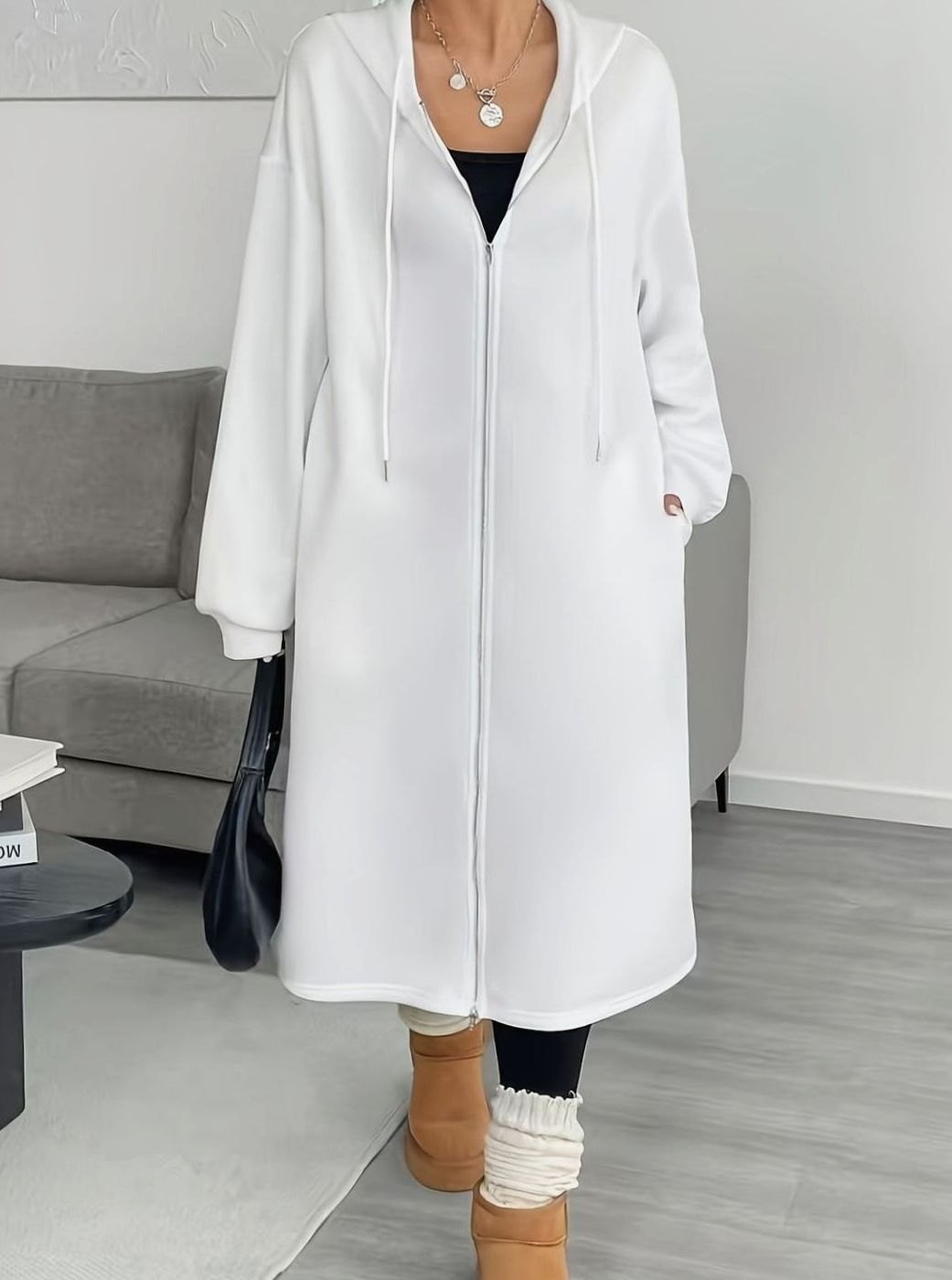 Women's oversized hooded zip-front winter coat with side pockets, casual long coat by Homixa, suitable for cold weather.