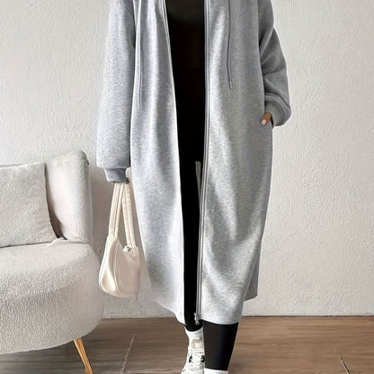 Women's oversized hooded zip front winter coat by Homixa with side pockets, long casual design, and cozy warm fit.
