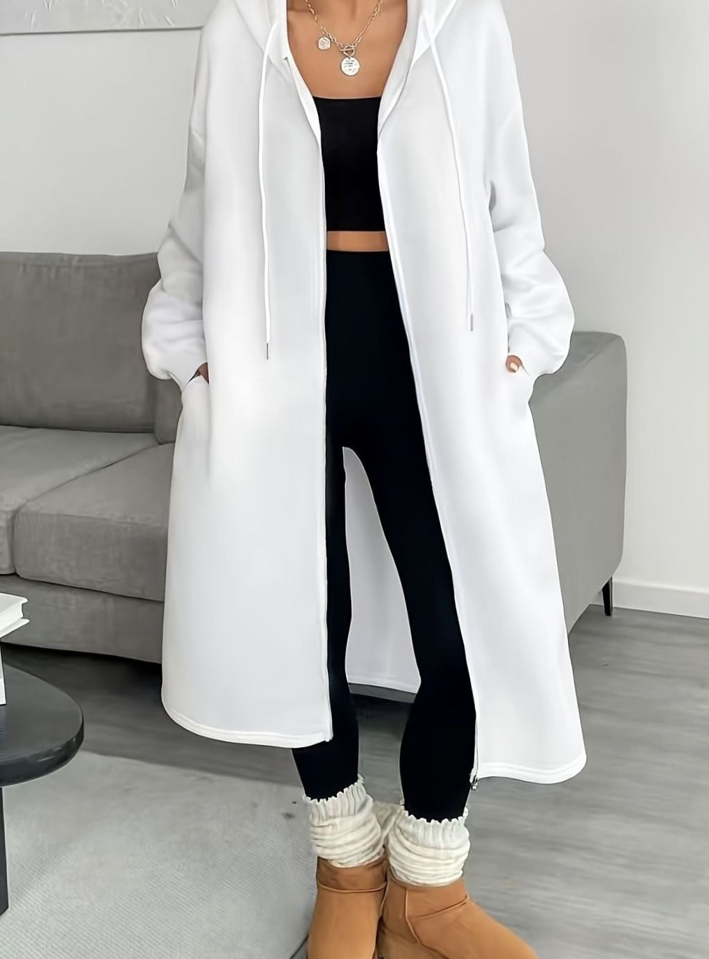 Women’s oversized hooded winter coat with zip front and side pockets, casual style by Homixa, long and warm for winter wear.