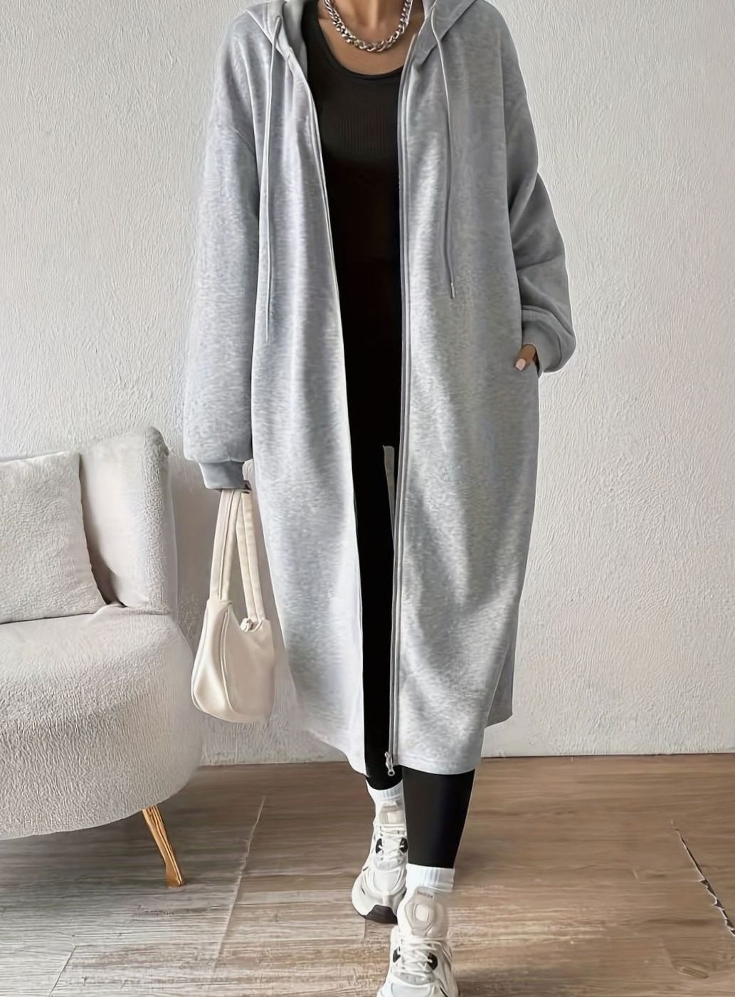 Women's oversized hooded zip-front winter coat by Homixa with side pockets, casual long coat for cold weather.