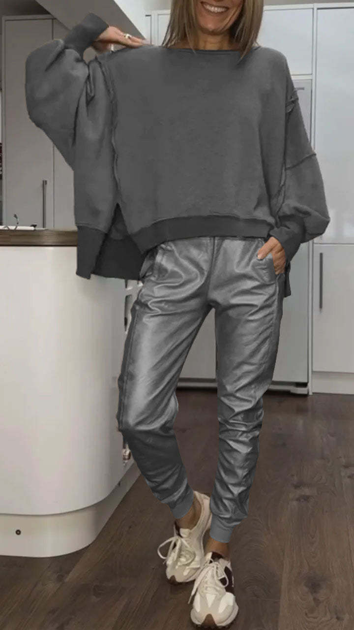 Women's oversized casual two-piece set by Homixa featuring a cozy sweater and satin pants, displayed on a model.