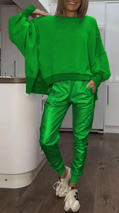 Women's oversized casual two-piece set by Homixa featuring a cozy sweater and satin pants, styled for relaxed comfort.