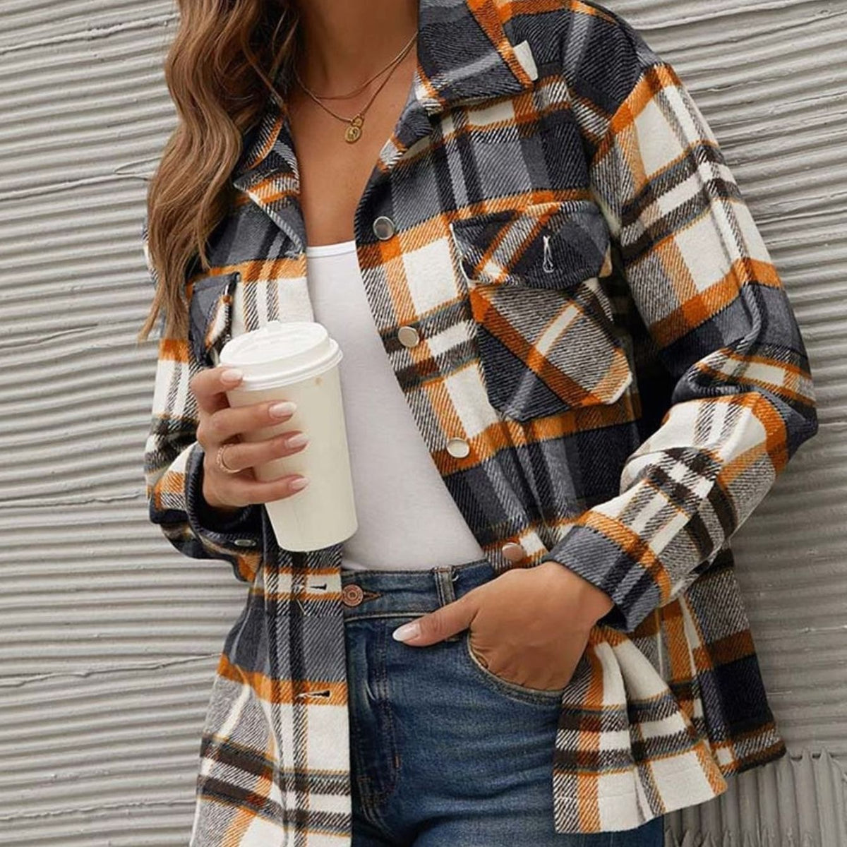 Women's relaxed-fit plaid shacket from Homixa featuring button-front closure and chest pockets, ideal for casual winter wear.