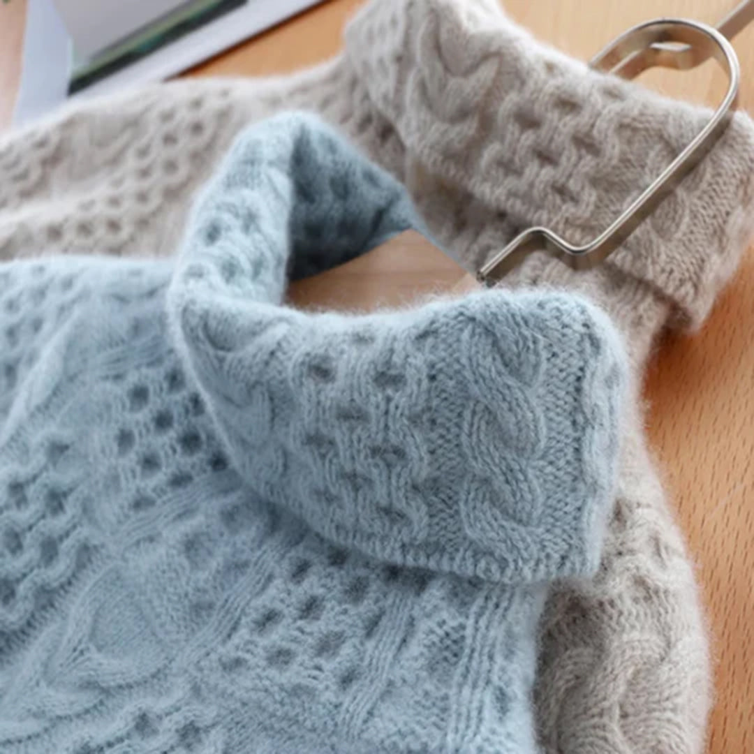 Homixa women's chunky cable-knit turtleneck sweater with ribbed hem and cuffs, cozy and stylish for cold weather.