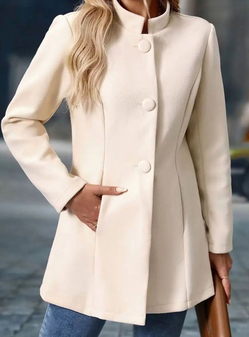 Women's Homixa winter coat with classic button-front design, stand collar, and side pockets, ideal for cold weather.