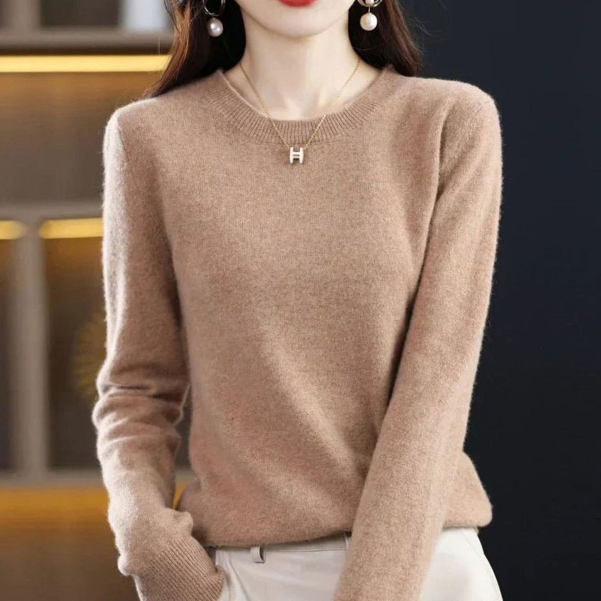 Women's Homixa long-sleeve crew-neck knit sweater with a soft, cashmere-like feel, featuring a classic design and cozy fit.