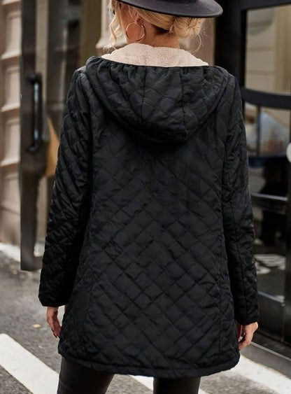 Women's mid-length quilted puffer winter jacket by Homixa with fleece lining, designed for warmth and comfort in cold weather.