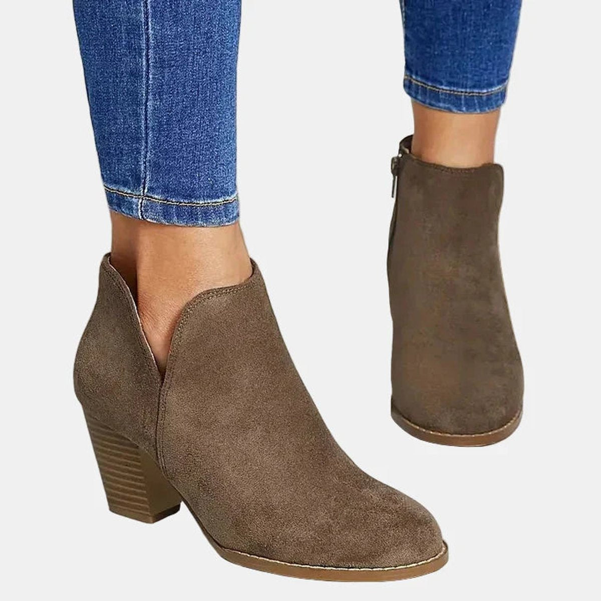 Women's suede-look block heel booties by Homixa with side zipper and lined insole, offering stylish comfort.