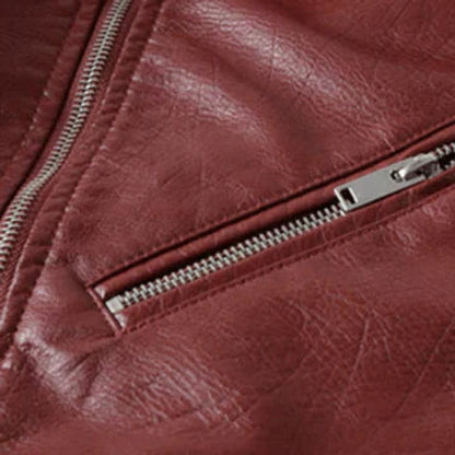 Women's faux-leather cropped biker jacket by Homixa featuring an asymmetric zipper, belted waist, and classic moto style.