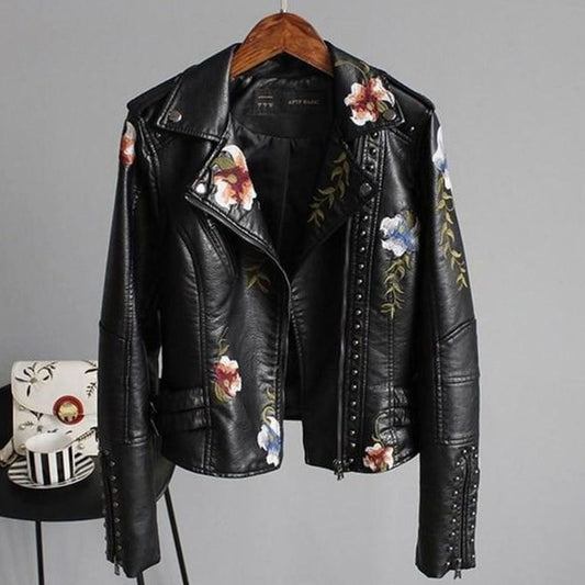 Women's faux-leather moto jacket by Homixa with floral embroidery and stud accents, cropped biker jacket style.