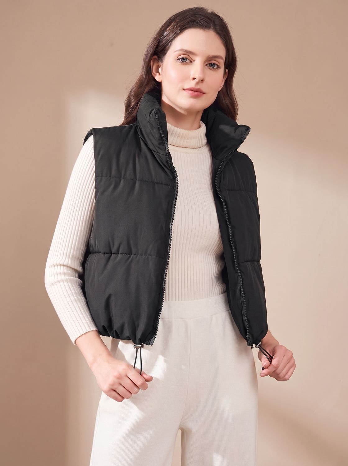 Women's Homixa cropped lightweight puffer vest with stand collar and two-way zipper, shown on a model.