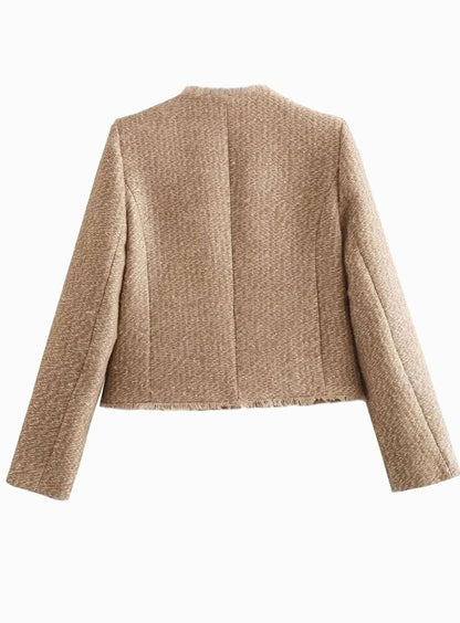 Women's cropped tweed blazer jacket by Homixa with button-front closure and tailored fit, shown on a model in a stylish setting.