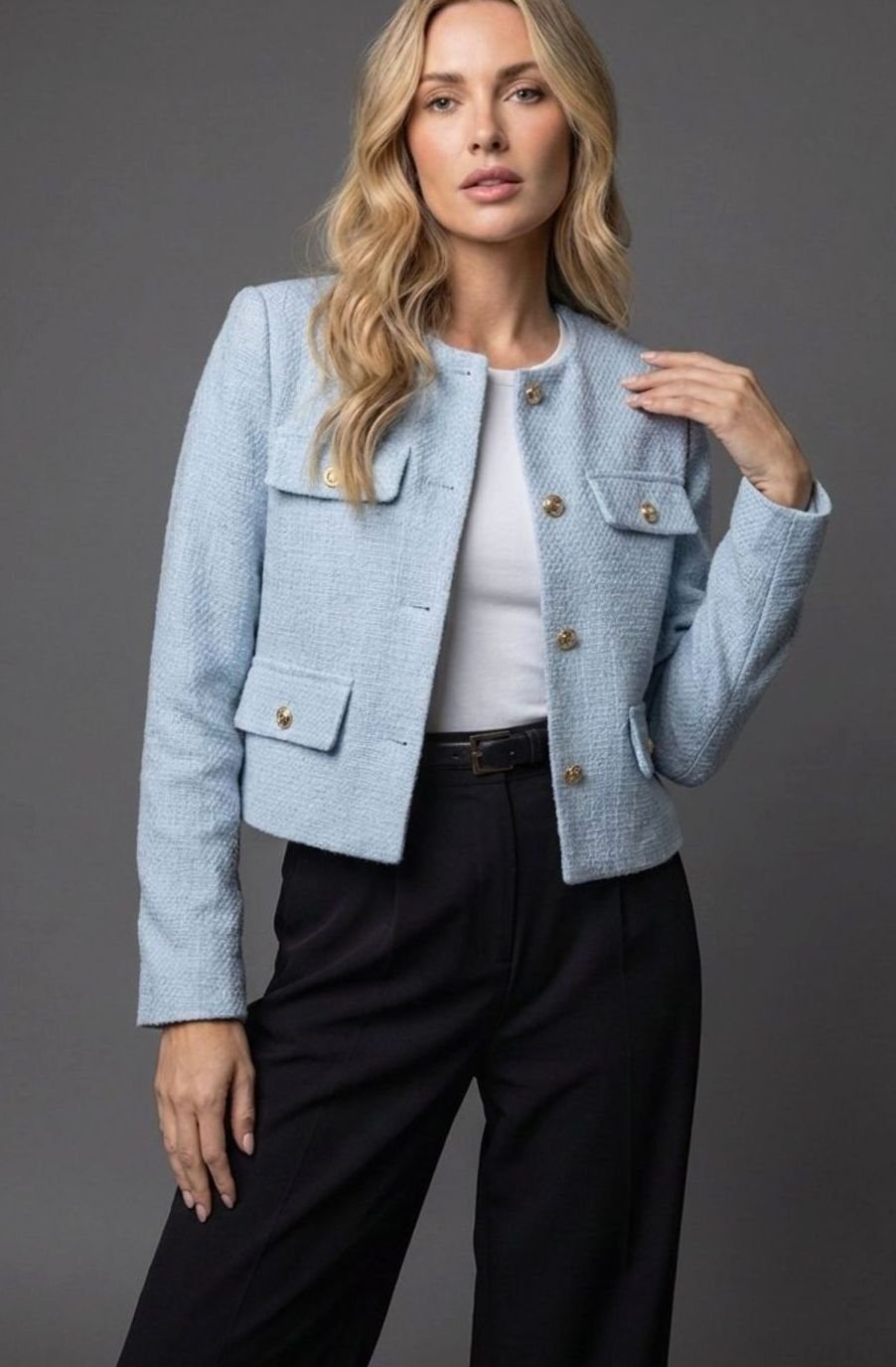 Women's cropped tweed blazer jacket by Homixa with gold buttons and flap pockets, styled for a sophisticated look.