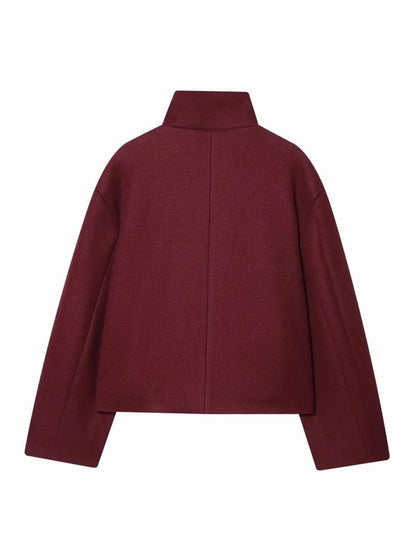 Women's vintage wool coat by Homixa featuring a stand collar, cropped length, and asymmetric button front style.