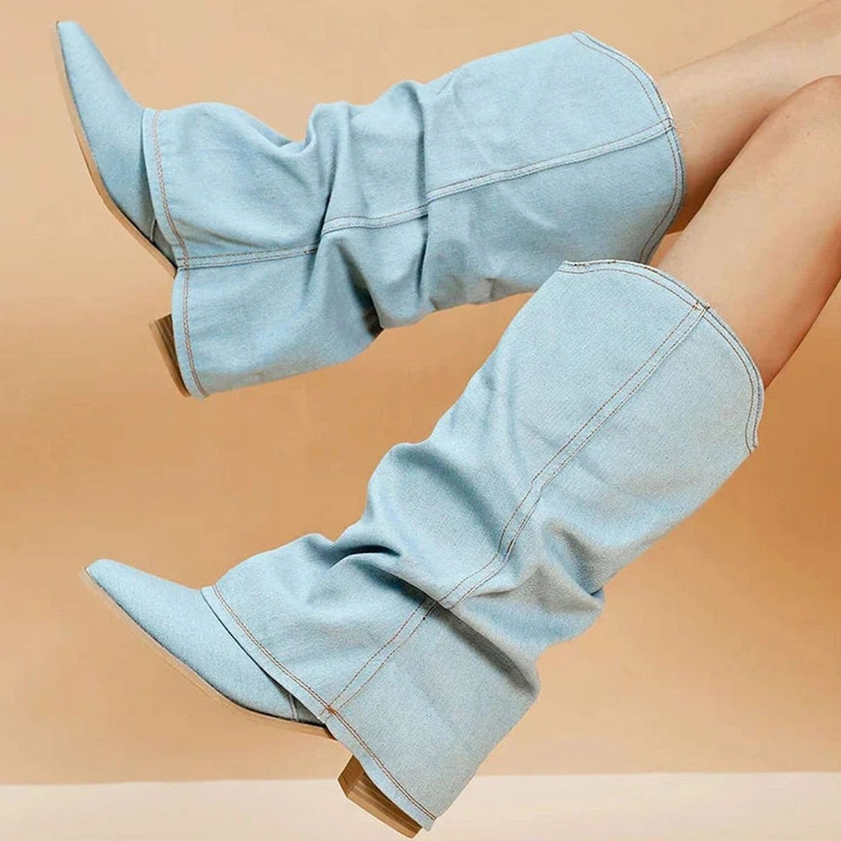 Women's denim western boots by Homixa with pleated shaft, pointed toe, and low block heel, styled for casual or western looks.