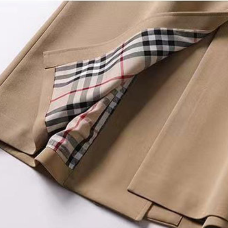 Women's Homixa double-breasted trench coat with belt, buckled cuffs, and plaid lining, displayed on a model.