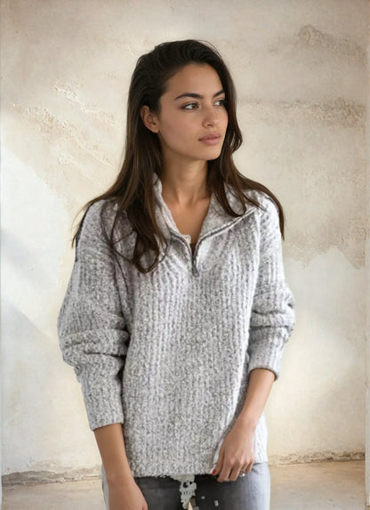 Women's elegant Homixa half-zip sweater with stand collar and soft knit fabric, shown in a close-up of the stylish neckline.