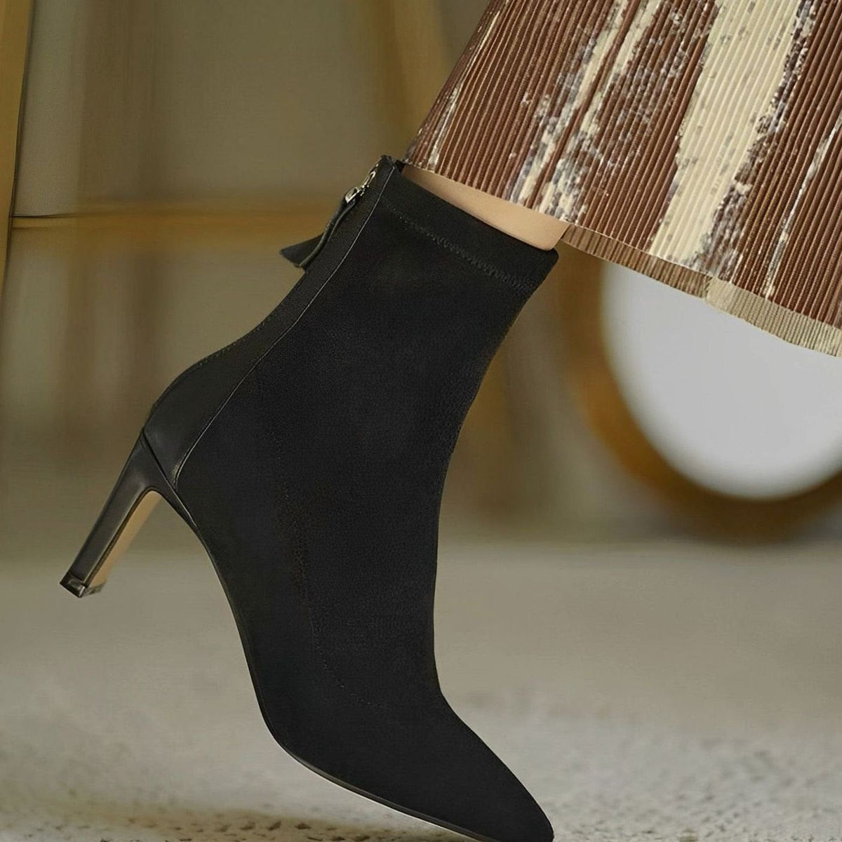 Elegant women's stiletto-heel ankle boots by Homixa featuring a stretch shaft and rear-zip closure, stylish and sophisticated footwear.