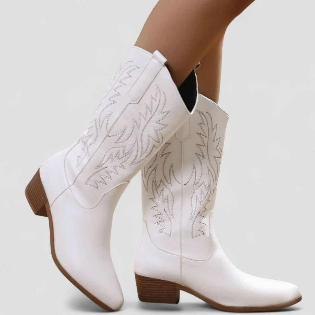 Women's embroidered Western boots by Homixa featuring a block heel and cushioned insole, detailed embroidery and stylish design.