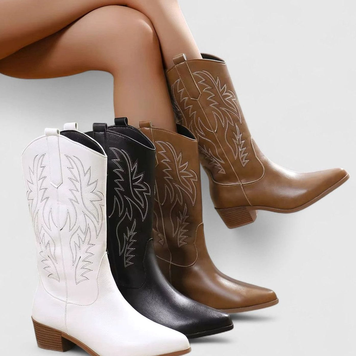 Women's embroidered western boots by Homixa with block heel and cushioned insole, showcasing intricate embroidery and stylish design.