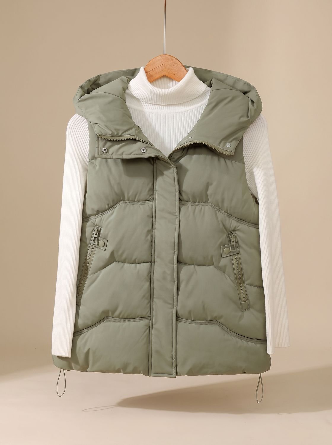 Women’s Homixa hooded padded puffer vest for fall and winter with zipper pockets, featuring a quilted design and cozy hood.
