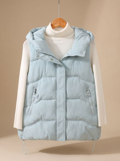 Women's Homixa padded hooded puffer vest with zipper pockets, ideal for fall and winter, featuring a warm, quilted design.