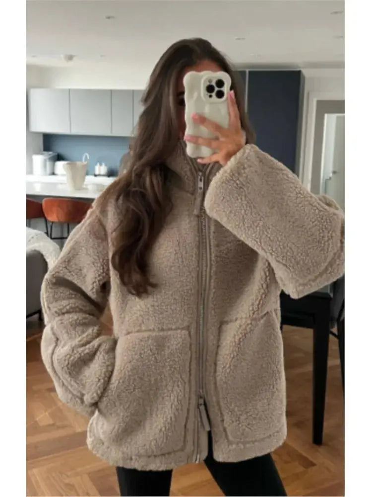 Women's faux-fur fleece jacket by Homixa featuring a high collar, zip front, and patch pockets, perfect for cozy winter wear.