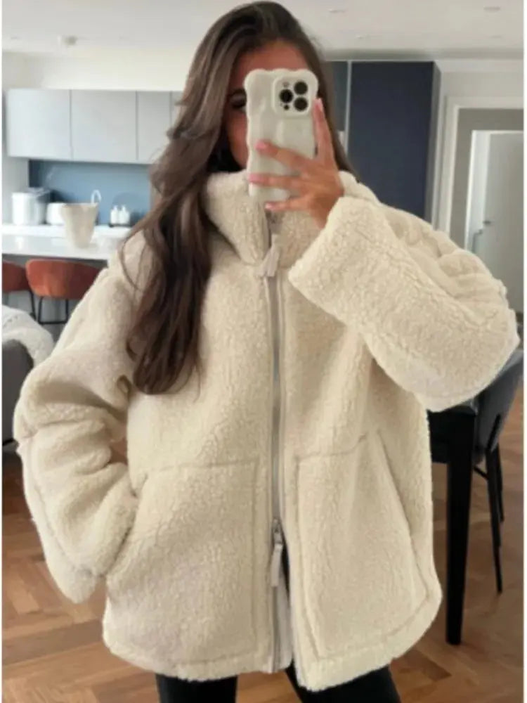 Women's faux-fur fleece jacket by Homixa featuring a high collar, zip front, and patch pockets, perfect for cozy winter wear.