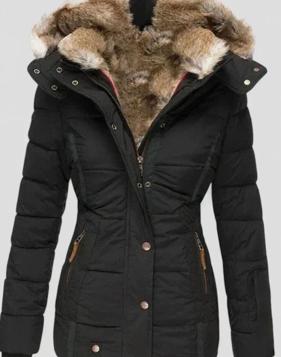 Women’s faux-fur hooded quilted puffer coat with zip front and shaped waist, shown in a stylish outdoor setting.