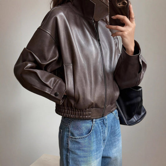 Women's faux-leather bomber jacket by Homixa with side pockets, zip front, and elastic hem, stylish and comfortable outerwear.