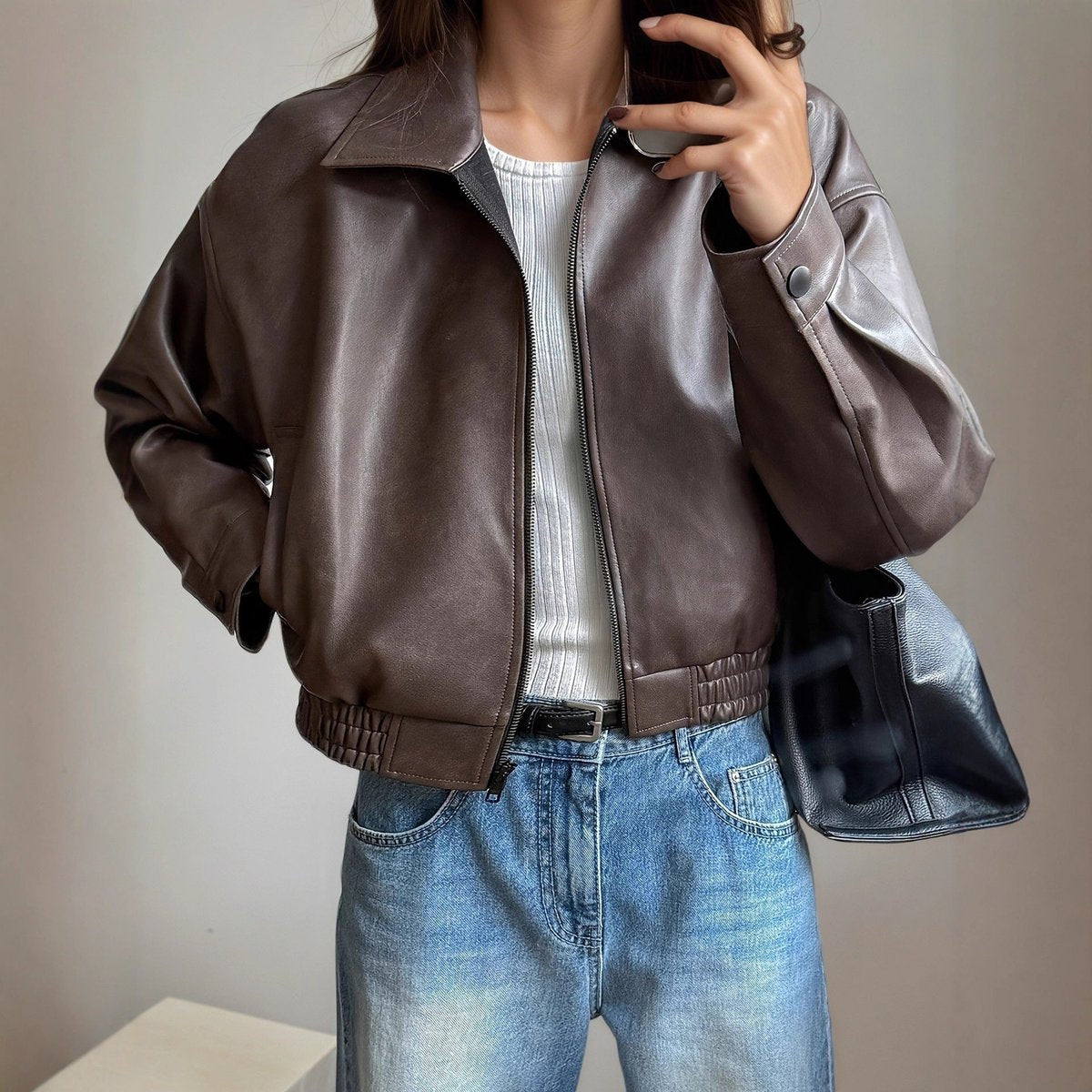 Women's faux-leather bomber jacket by Homixa with side pockets, zip front, and elastic hem, stylish outerwear for women.