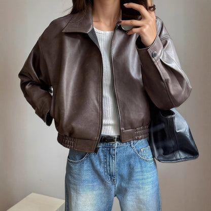 Women's faux-leather bomber jacket by Homixa with side pockets, zip front, and elastic hem, stylish outerwear for women.