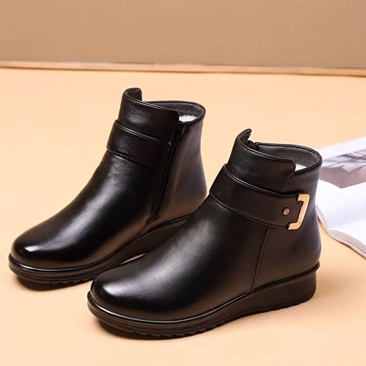 Homixa women's faux-leather fleece-lined booties with buckle accent and side zipper for stylish winter wear.