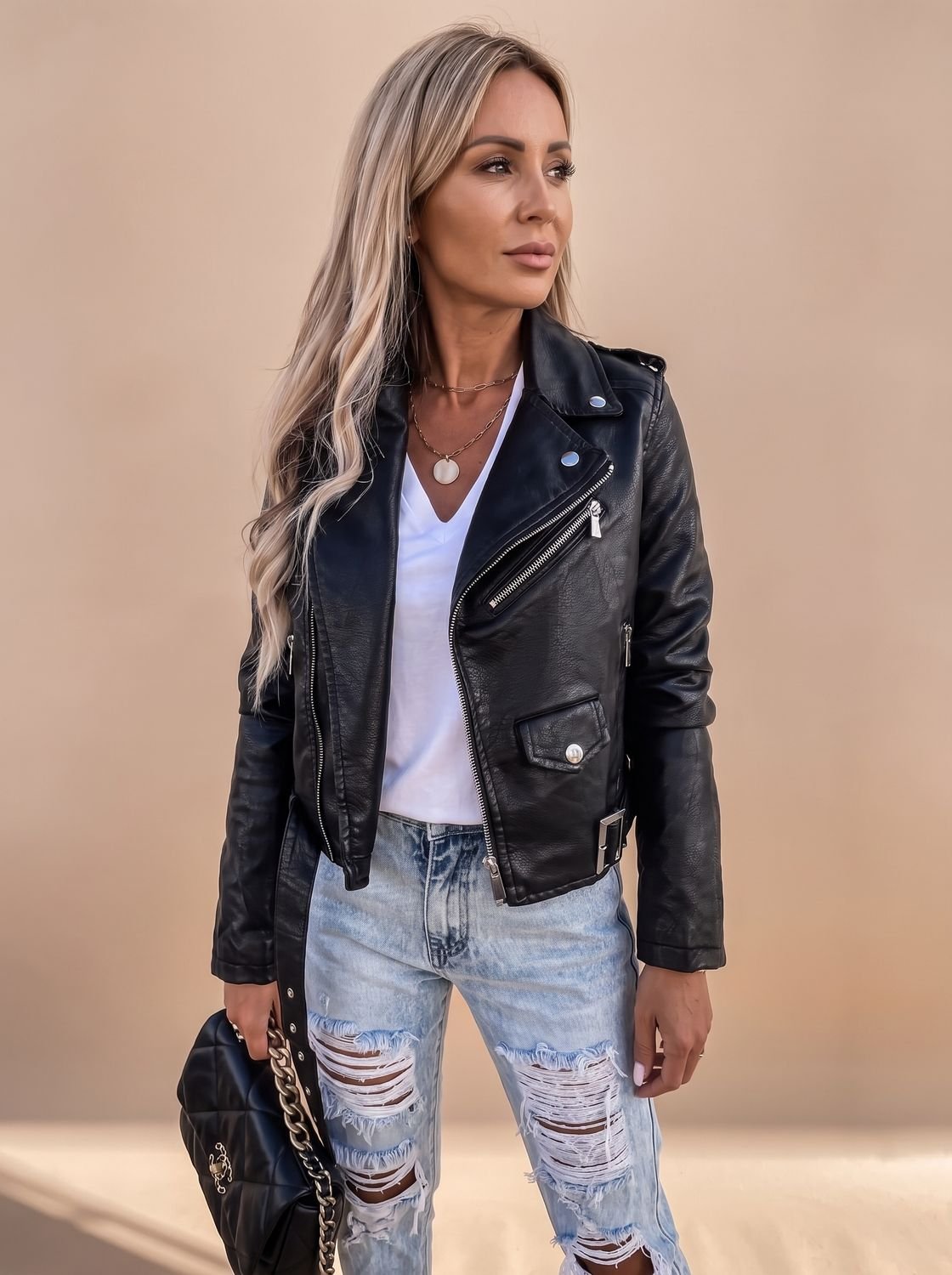 Women's faux-leather moto jacket with diagonal zip and fitted silhouette, stylish biker jacket from Homixa.