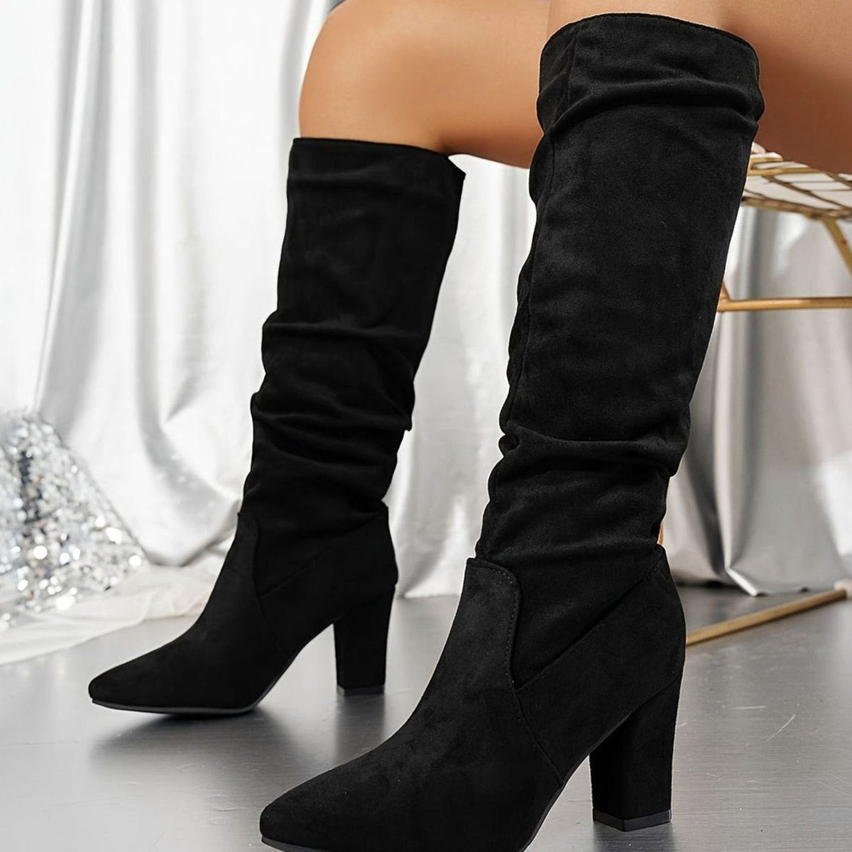 Homixa women's faux-suede slouch boots with knee-high shaft and sturdy block heel, showcasing a stylish and comfortable footwear design.