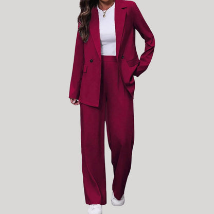 Women's fitted double-breasted tailored pantsuit with blazer and pants, stylish and professional for office wear.