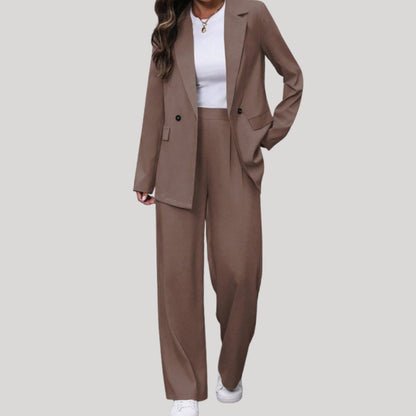 Women's fitted double-breasted tailored pantsuit with blazer and matching pants, stylish and professional for formal wear.