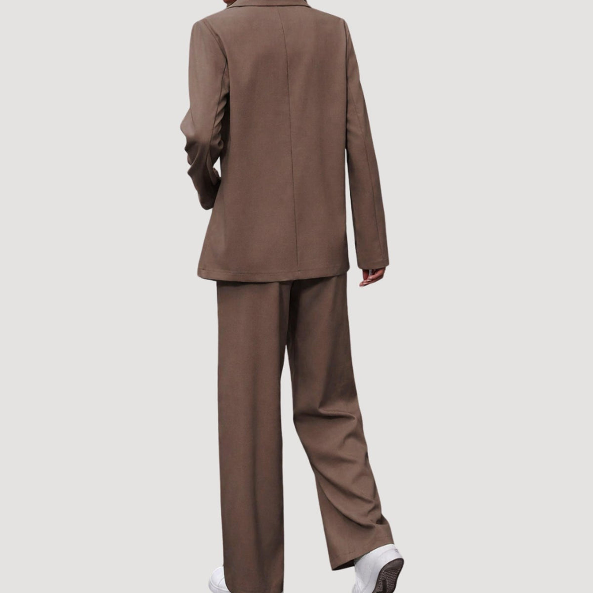 Women's fitted double-breasted tailored pantsuit with blazer and pants by Homixa, styled for a polished professional look.