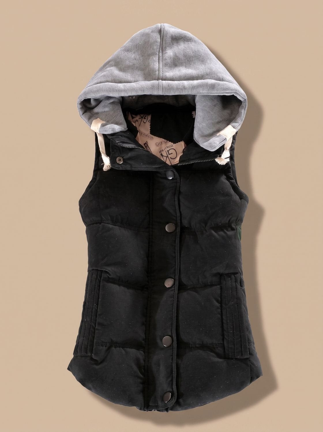 Women's fitted puffer vest with quilted fill and detachable contrast hood by Homixa, shown with front view and stylish design.