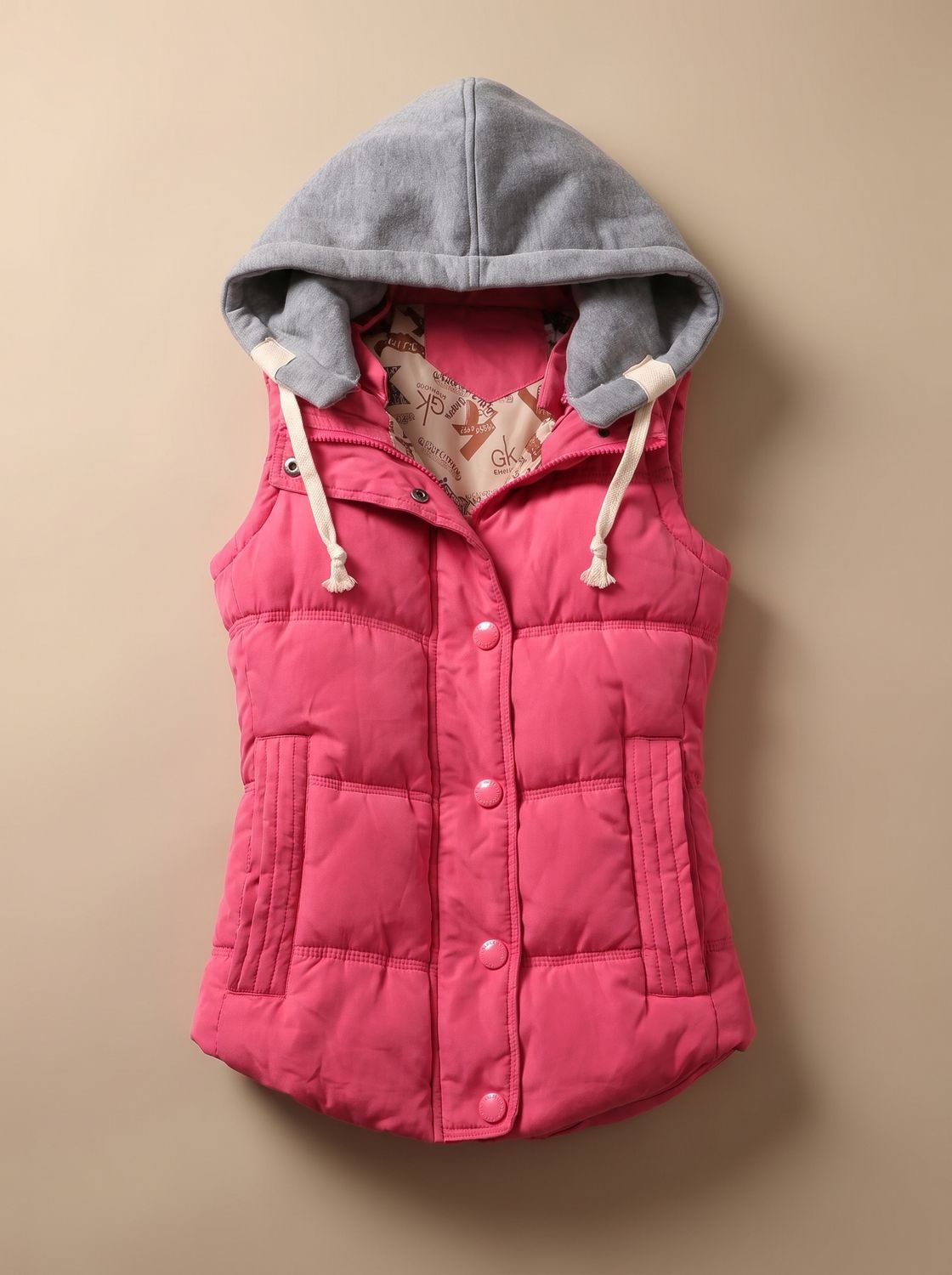 Women's Homixa fitted puffer vest with quilted fill and detachable contrast hood, shown on a model with front view.