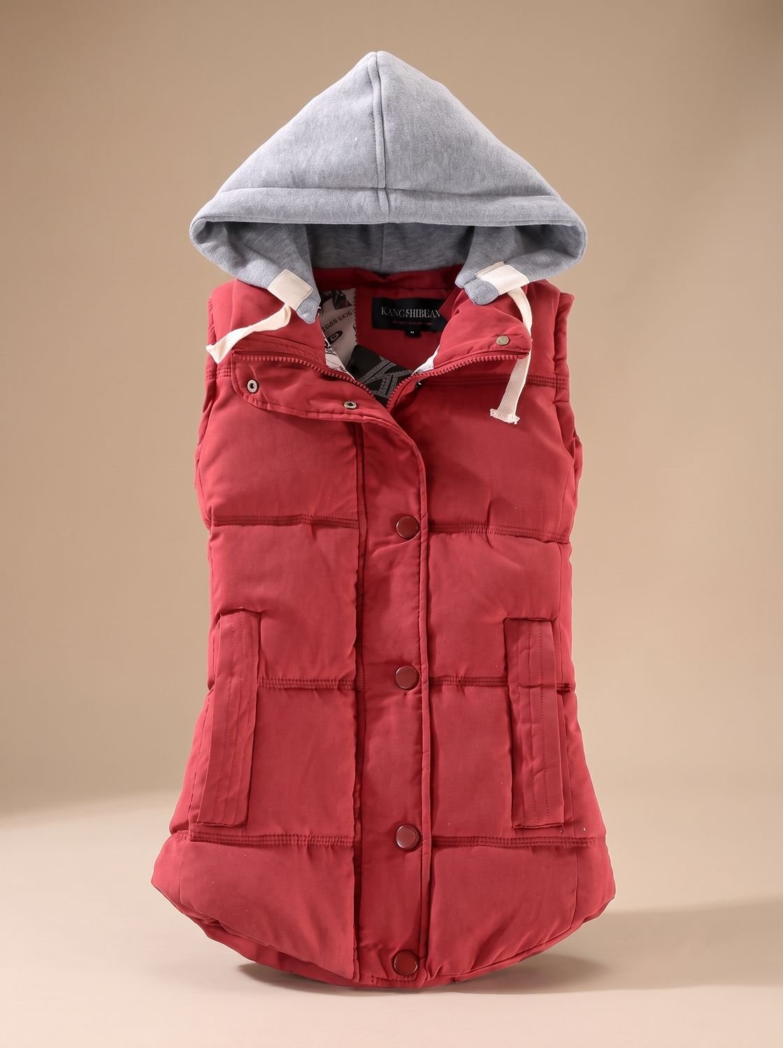 Women's fitted puffer vest with quilted fill and detachable contrast hood, stylish hooded outerwear by Homixa.