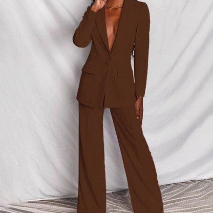 Women's fitted tailored pantsuit by Homixa featuring a one-button blazer and wide-leg pants, styled for a professional look.