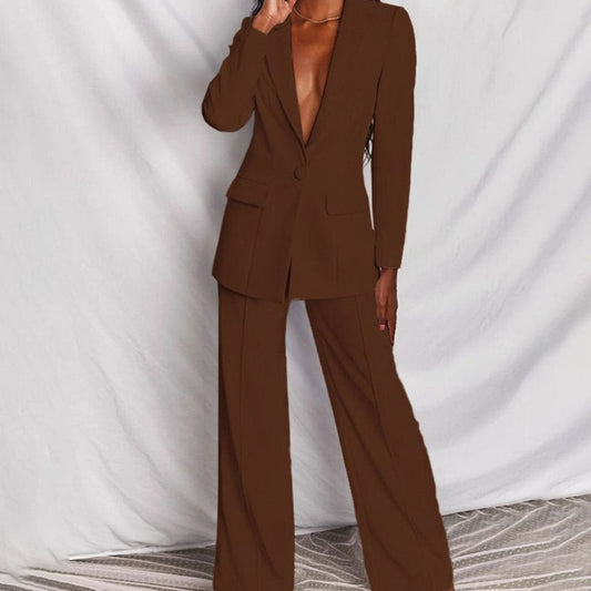 Women's fitted tailored pantsuit by Homixa featuring a one-button blazer and wide-leg pants, styled for a professional look.
