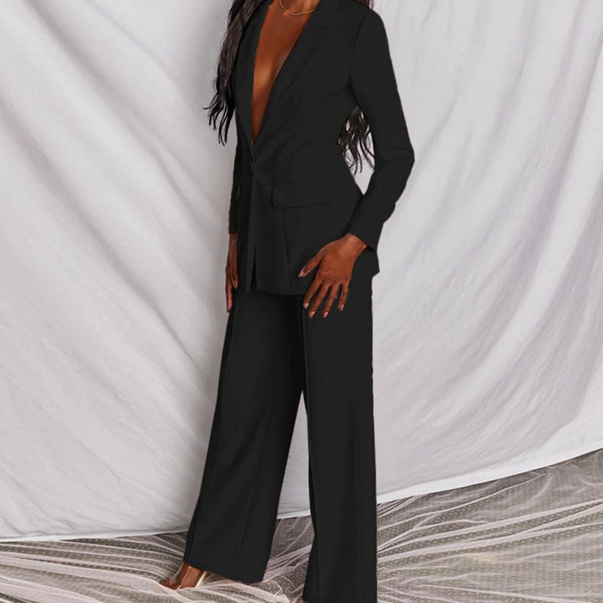 Women's fitted tailored pantsuit by Homixa featuring a one-button blazer and wide-leg pants, perfect for professional or formal wear.