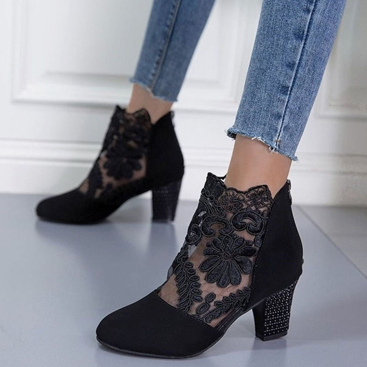 Women's floral lace-accent booties with block heel and back-zip closure by Homixa, showcasing elegant lace details and stylish design.