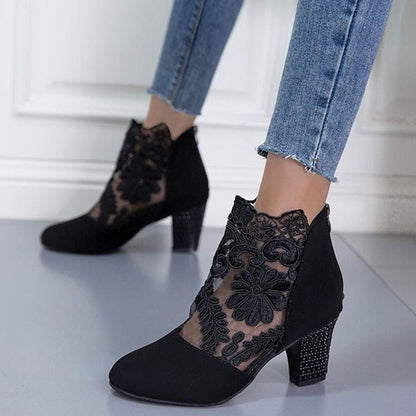 Women's floral lace-accent booties with block heel and back-zip closure by Homixa, showcasing elegant lace details and stylish design.